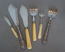 A pair of silver handled fish servers, a pair of bone handled silver fish servers and two other