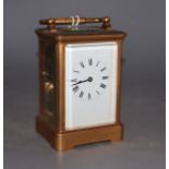 An early 20th century lacquered brass carriage timepiece, height 12cm