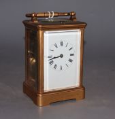 An early 20th century lacquered brass carriage timepiece, height 12cm