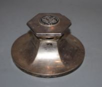 A George V silver circular inkwell, with hexagonal lid and central boss inscribed 'The Hon. The