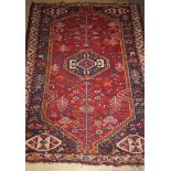 A Caucasian red ground rug, 166 x 116cm