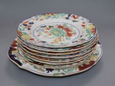 Seven Mason's Ironstone plates and a dish