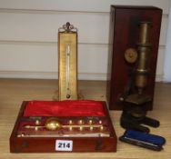 A cased microscope, a cased Sikes' hydrometer and two thermometers