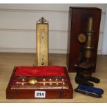 A cased microscope, a cased Sikes' hydrometer and two thermometers