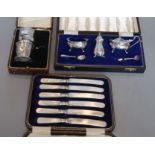 A cased modern three piece silver condiment set, London, 1967, a cased silver part christening set