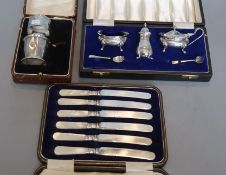 A cased modern three piece silver condiment set, London, 1967, a cased silver part christening set