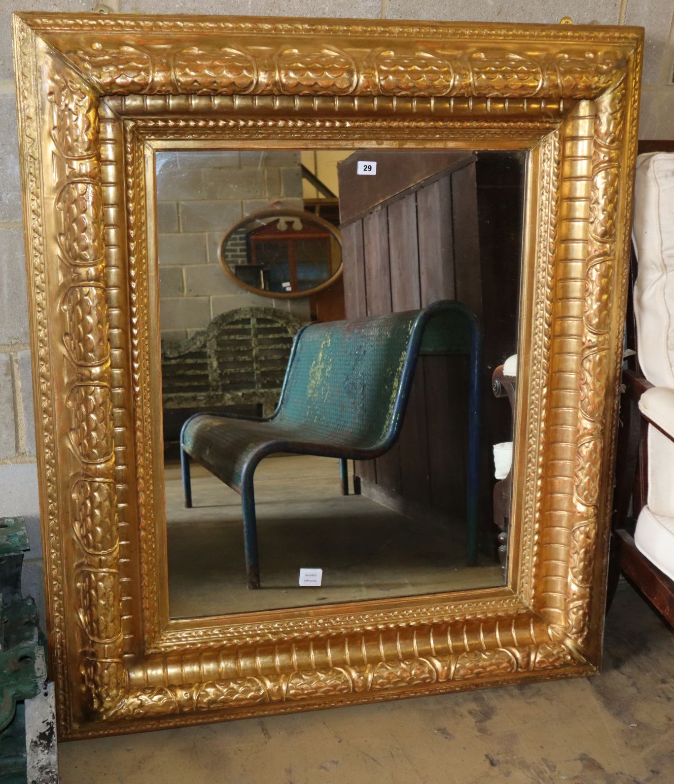 A Victorian carved giltwood "picture frame" wall mirror, with bevelled plate, W.110cm, H.130cm