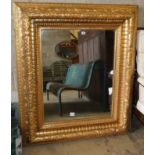 A Victorian carved giltwood "picture frame" wall mirror, with bevelled plate, W.110cm, H.130cm