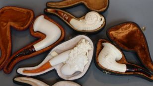 Four various Meerschaum pipes, in fitted case