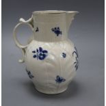 A Caughley cabbage leaf mask jug, c.1780, with scroll handle, decorated with floral sprays in