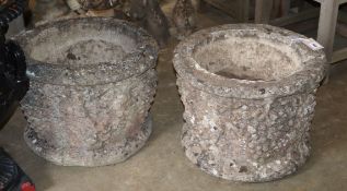 A pair of circular stone vineous planters, diameter 46cm, H.36cm