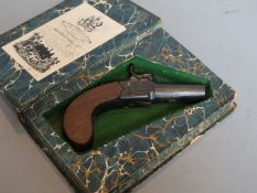 A 19th century boxlock percussion pistol concealed in a copy of 'Forty Five Guardsmen'CONDITION: The