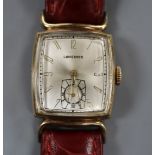 A lady's 1950's? 10k gold filled Longines manual wind wrist watch, on later associated strap.