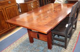 An Australian redwood dining table from the workshops of Nicholas Dattner & Co., W.196cm, D.111cm,