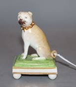 A rare Derby seated figure of a pug dog, c.1830, modelled by Edward Keys, Condition - two ball