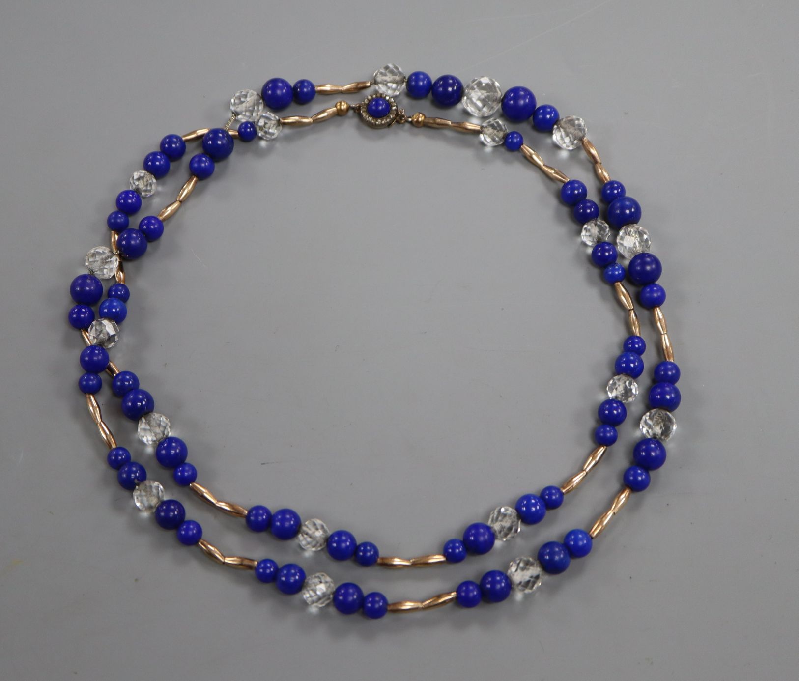 A yellow metal, lapis lazuli and paste set necklace, with rose cut diamond set clasp, 88cm, gross 59