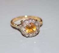 A 19th century 18ct, citrine and round cut diamond set cluster ring, size R, gross 4.4 grams.