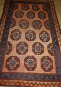 A Turkish peach ground rug, 200 x 134cm