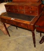 A mid 19th century French mahogany desk, with pull-out leather inset writing surface, W.98cm, D.