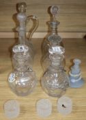 A pair of cut glass decanters, three other decanters, a claret jug and other glassware together with