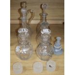 A pair of cut glass decanters, three other decanters, a claret jug and other glassware together with