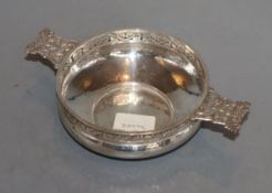 A George V Arts & Crafts pierced and planished silver two handled bowl (lacking liner?), by Albert