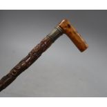 A Victorian walking stick, carved with a crown, an anchor and oak leaves, length 85cm