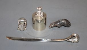 Four small silver novelty items by Sarah Jones, comprising Winnie-the-Pooh and Honeypot, a badger, a