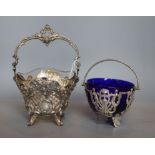A late 19th/early 20th century German pierced 800 white metal sugar basket, with associated liner,