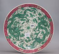 A Japanese porcelain 'dragon' dish, diameter 40cmCONDITION: There is a splinter chip to the rim, not