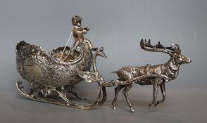 A late 19th century German silver bonbon dish, modelled as a reindeer pulling a sleigh with