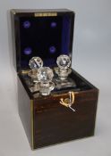 An early Victorian coromandel and brass bound four division decanter box, the lid inset with