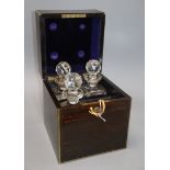 An early Victorian coromandel and brass bound four division decanter box, the lid inset with