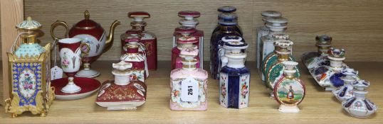 A collection of French porcelain scent bottles and a teapot (24)