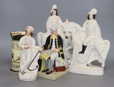 Three Staffordshire figures, a Doulton jug and a Doulton figure 'Captain Cook'