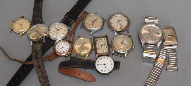 Twelve assorted gentleman's wristwatches including Seiko, Roamer, Bulova and Zodiac.