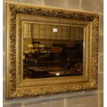 A late Victorian gilt carved wood "picture frame" wall mirror, W.102cm, H.86cmCONDITION: It has been