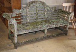 A Lutyens style weathered teak garden bench, W.200cm, D.50cm, H.106cmCONDITION: The majority of