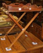 A Victorian mahogany galleried butler's tray, on folding stand, tray W.64cm, D.50cm, H.78cm