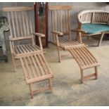 A pair of teak garden steamer chairsCONDITION: As new condition