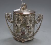 A WMF Art Nouveau embossed plated two handled mounted biscuit box, with a clear glass liner,