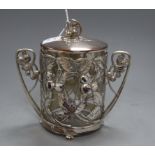 A WMF Art Nouveau embossed plated two handled mounted biscuit box, with a clear glass liner,