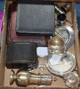 A silver sugar caster, a four-piece silver cruet set, a cased set of six napkin rings(a.f.), six