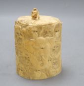 A Japanese ivory box and cover, Meiji Period, carved with elephants, lions, monkeys, etc. (lacking