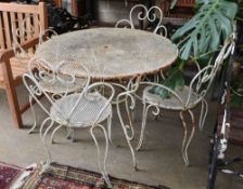 A wrought iron circular garden table and four chairs, table 98cm diameterCONDITION: The pierced