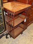 An Edwardian mahogany revolving bookcase, W.60cm, D.60cm, H.92cmCONDITION: It has two vertical