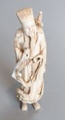 A Chinese ivory figure of Lu Dongbin, early 20th century, H. 14.5cm