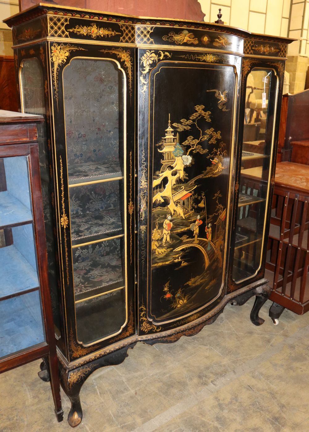 A 1920's chinoiserie lacquer bow front display cabinet, W.130cm, D.46cm, H.165cm