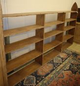 A Gothic style oak open bookcase, W.259cm, D.25cm, H.156cm