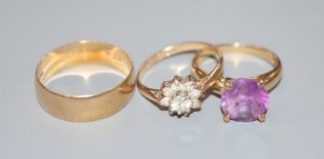 Three modern 9ct gold rings, including single stone amethyst and a wedding band, gross 6.7 grams.